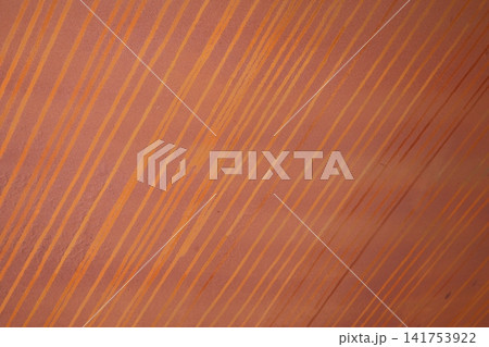 Abstract terracotta background with diagonal orange paint streaks 141753922