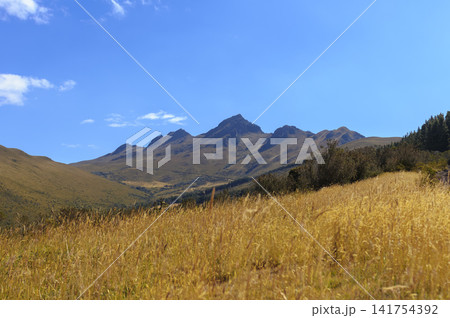 Panoramic view of the peaks of the extinct Pasochoa volcano from its eastern slopes in the Andes Mountains, Ecuador, under a clear blue sky Panoramic view of the peaks of the extinct Pasochoa volcano from its eastern slopes in the Andes Mountains, Ecuador, under a clear blue sky 141754392