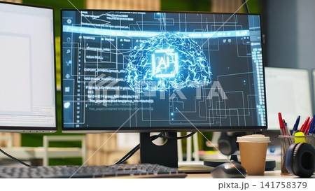 PC in startup office used to design and implement algorithms enabling machine learning. Technology unicorn venture workspace with computer used to conduct code reviews to fix bugs 141758379