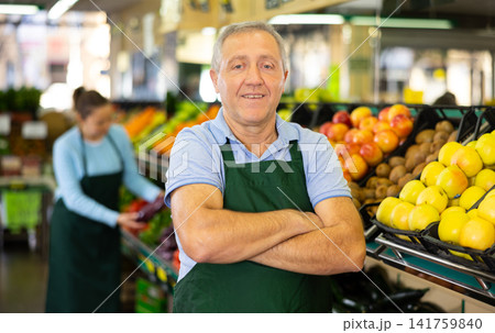 vegetable salesman in supermarket 141759840