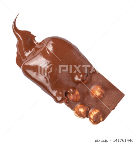Milk chocolate bar with hazelnuts covered by melted chocolate isolated on light background Milk chocolate bar with hazelnuts covered by melted chocolate isolated on light background 141761440