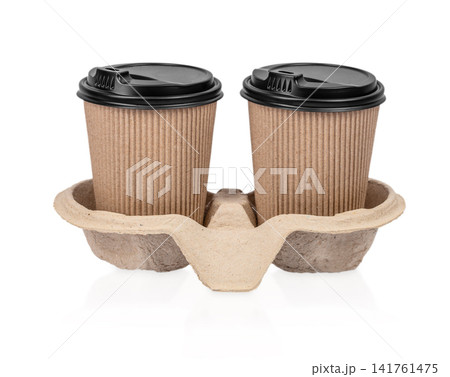 Two Takeaway Coffee Cups in Recycled Carrier Isolated on Light Background Two Takeaway Coffee Cups in Recycled Carrier Isolated on Light Background 141761475