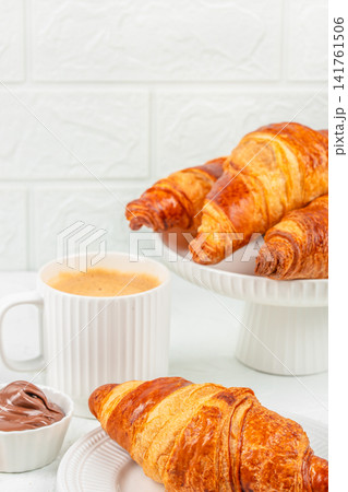 Fresh Croissants with Coffee and Chocolate Spread for Breakfast Fresh Croissants with Coffee and Chocolate Spread for Breakfast 141761506