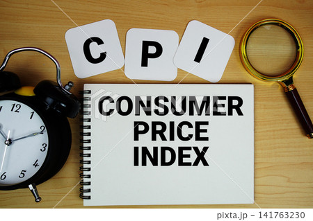 CPI Consumer Price Index text written on notepad with magnifying glass and alarm clock on wooden background CPI Consumer Price Index text written on notepad with magnifying glass and alarm clock on wooden background 141763230