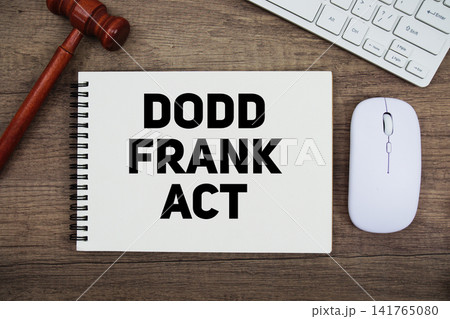 DODD Frank Act text written on notepad with gavel and keyboard on wooden background DODD Frank Act text written on notepad with gavel and keyboard on wooden background 141765080