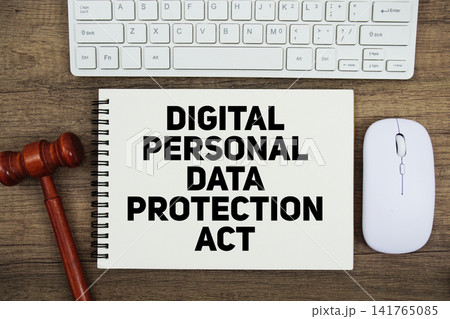 Digital Personal Data Protection Act text written on notepad with gavel and keyboard on wooden background Digital Personal Data Protection Act text written on notepad with gavel and keyboard on wooden background 141765085