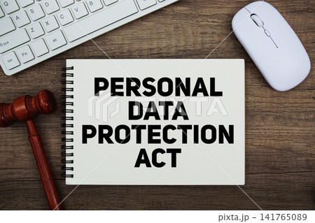 PDPA Personal Data Protection Act text written on notepad with gavel and keyboard on wooden background 141765089