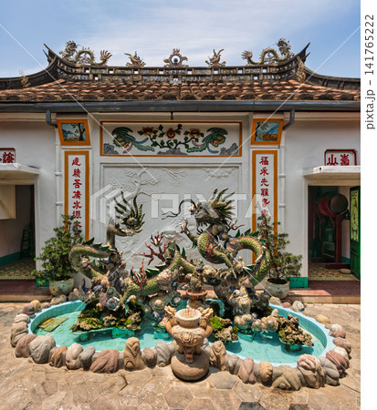 Ornate dragon sculpture in the fountain at Fujian Assembly Hall in Hoi An Ancient Town, Vietnam Ornate dragon sculpture in the fountain at Fujian Assembly Hall in Hoi An Ancient Town, Vietnam 141765222