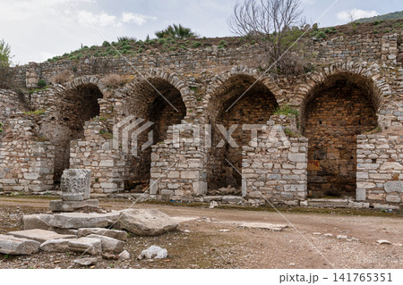 East Gymnasium ancient ruins with stone arches, Ephesus, Selcuk, Turkey East Gymnasium ancient ruins with stone arches, Ephesus, Selcuk, Turkey 141765351