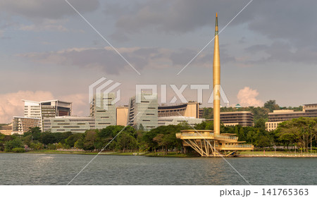 Millennium Monument and Putrajaya Lake with modern buildings in Putrajaya, Malaysia Millennium Monument and Putrajaya Lake with modern buildings in Putrajaya, Malaysia 141765363