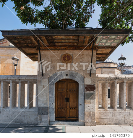 Hamushan Gate entrance Mevlana Museum Konya Turkey ornate wooden door stone archway and decorative canopy Hamushan Gate entrance Mevlana Museum Konya Turkey ornate wooden door stone archway and decorative canopy 141765379