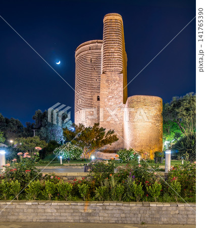 Maiden Tower illuminated at night with a crescent moon in the Old City of Baku, Azerbaijan Maiden Tower illuminated at night with a crescent moon in the Old City of Baku, Azerbaijan 141765390