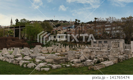 Agora of Smyrna ruins with Izmir city, minaret, and Kadifekale hill in background, Izmir Turkey Agora of Smyrna ruins with Izmir city, minaret, and Kadifekale hill in background, Izmir Turkey 141765474