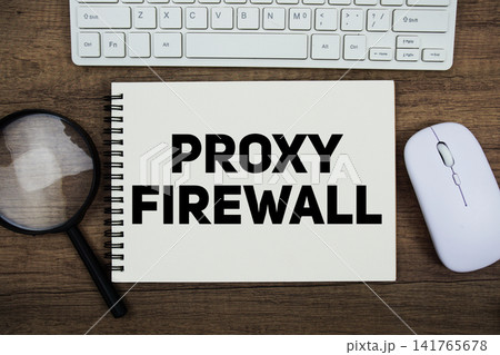 Proxy Firewall message with keyboard and optical mouse on wooden background Proxy Firewall message with keyboard and optical mouse on wooden background 141765678