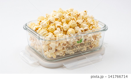 Clear glass container filled with freshly popped crunchy popcorn container background isolated appetizer transparent homemade delicious snacking vegetarian rectangular gathering cravings Clear glass container filled with freshly popped crunchy popcorn container background isolated appetizer transparent homemade delicious snacking vegetarian rectangular gathering cravings 141766714