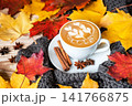Cozy autumn coffee with love word latte art and warm scarf 141766875