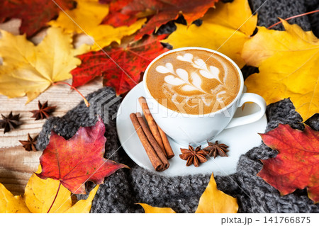 Cozy autumn coffee with love word latte art and warm scarf Cozy autumn coffee with love word latte art and warm scarf 141766875