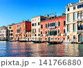 Traditional Venetian architecture lining the Grand Canal in Venice, Italy. Vibrant waterfront scene showcasing the beauty of this world-famous city. 141766880