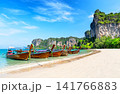 Traditional Thai longtail boats anchored on the white sand of Railay Beach near Ao Nang, Krabi in Thailand. 141766883