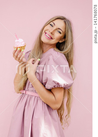 Cheerful Woman With Cupcake On Pink Background Cheerful Woman With Cupcake On Pink Background 141768078