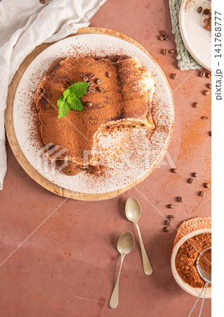 Top view of homemade traditional tiramisu cake Top view of homemade traditional tiramisu cake 141768777