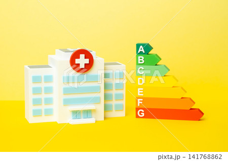 A hospital and an efficiency scale. An energy efficiency rating range. Good medical performance figures and quality care standards. Healthcare excellence. Autonomy and energy efficiency. A hospital and an efficiency scale. An energy efficiency rating range. Good medical performance figures and quality care standards. Healthcare excellence. Autonomy and energy efficiency. 141768862