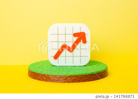 A rising graph on a plot of land. Rising land prices, increasing rental income. Land tax increases. A rising graph on a plot of land. Rising land prices, increasing rental income. Land tax increases. 141768871