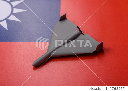 A Shahed drone featuring a prohibition symbol on the taiwanese flag as a conceptual background A Shahed drone featuring a prohibition symbol on the taiwanese flag as a conceptual background 141768925