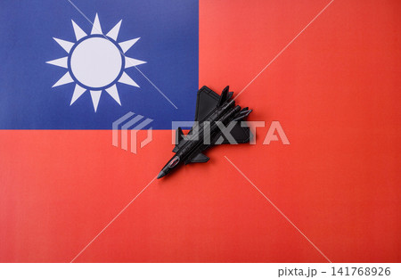 A fighter jet against the taiwanese flag as a conceptual background representing defense A fighter jet against the taiwanese flag as a conceptual background representing defense 141768926