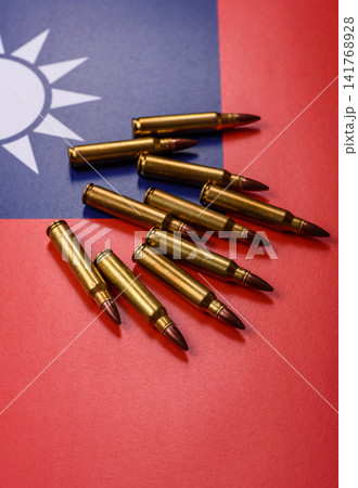 Assault rifle cartridges on the taiwanese flag, serving as a conceptual background for defense 141768928