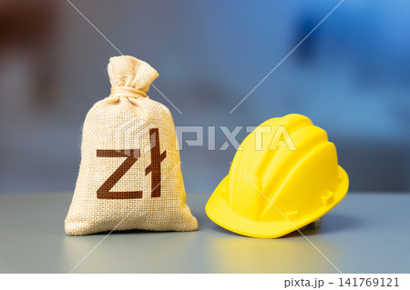 Polish zloty is a money bag and a yellow construction worker's hard hat. Capital drives development. Urban growth and industrial expansion. Investments in real estate and infrastructure construction. 141769121