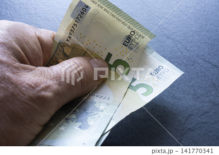 several 5 euro banknotes several 5 euro banknotes 141770341