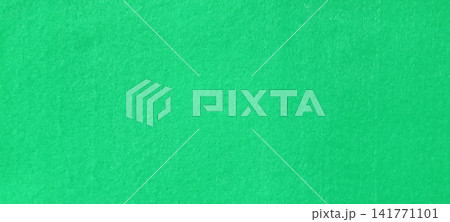 Vibrant green textured surface with even lighting and uniform color 141771101