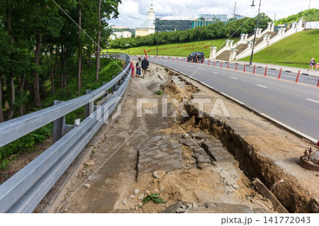 A major ground collapse and destruction of the sidewalk on Bolshaya Sovetskaya Street in Smolensk. A major ground collapse and destruction of the sidewalk on Bolshaya Sovetskaya Street in Smolensk. 141772043