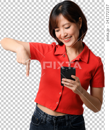 Asian woman smartphone red shirt pointing isolated portrait, smiling while checking mobile phone against transparent background Asian woman smartphone red shirt pointing isolated portrait, smiling while checking mobile phone against transparent background 141772357