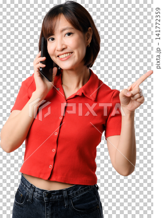 Asian woman holding smartphone red shirt points and smiles while isolated portrait expresses friendly customer support during cheerful Asian woman holding smartphone red shirt points and smiles while isolated portrait expresses friendly customer support during cheerful 141772359