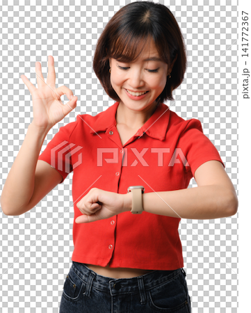 Asian woman checking smartwatch wearing red shirt with OK gesture and cheerful smile against isolated transparent background for health technology Asian woman checking smartwatch wearing red shirt with OK gesture and cheerful smile against isolated transparent background for health technology 141772367