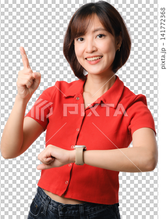 Asian woman red shirt pointing upward isolated portrait with cheerful smile and wristwatch, showing time, idea and communication concept 141772368