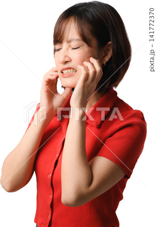 Asian woman, red shirt, toothache, jaw pain, closed eye and tense facial expression, isolated against transparent background Asian woman, red shirt, toothache, jaw pain, closed eye and tense facial expression, isolated against transparent background 141772370