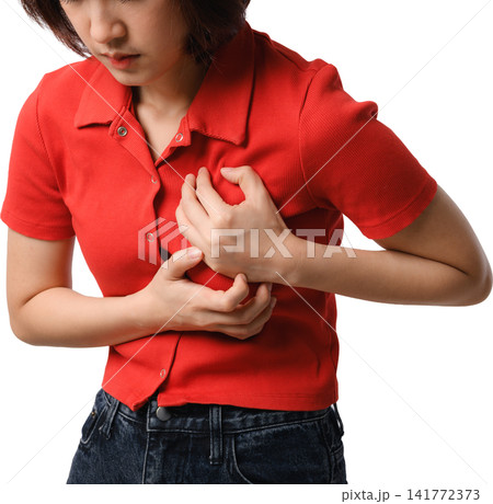 Asian woman red shirt chest pain portrait torso discomfort clutching chest showing concern through tense gesture within isolated studio Asian woman red shirt chest pain portrait torso discomfort clutching chest showing concern through tense gesture within isolated studio 141772373