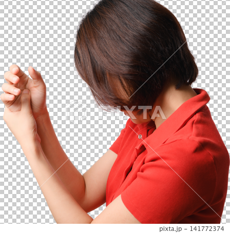 Asian woman red shirt hand gesture isolated portrait showing distress with raised arm and covered face against transparency background 141772374