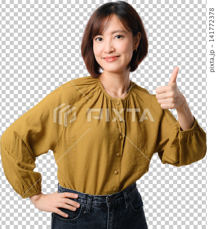 Asian woman thumbs up isolated portrait mustard blouse positive gesture confident smile with hand on waist against transparent background Asian woman thumbs up isolated portrait mustard blouse positive gesture confident smile with hand on waist against transparent background 141772378