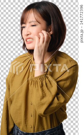 Asian woman smiling portrait isolated in mustard blouse touching cheek with gentle expression and relaxed pose against transparent background Asian woman smiling portrait isolated in mustard blouse touching cheek with gentle expression and relaxed pose against transparent background 141772396