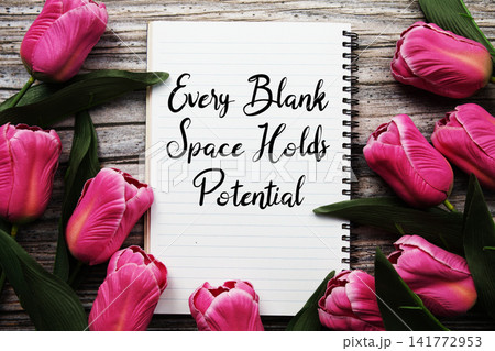 Every Blank Space Holds Potential text written on notepad with flower decoration on wooden background Every Blank Space Holds Potential text written on notepad with flower decoration on wooden background 141772953