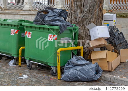 Overflowing Mixed Waste Containers 141772999