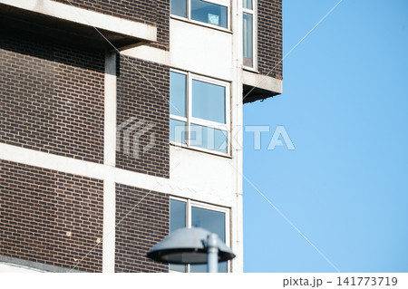 Corby, Northamptonshire, UK - August 2, 2026: Corner of office building with street lamp in Corby, England Corby, Northamptonshire, UK - August 2, 2026: Corner of office building with street lamp in Corby, England 141773719