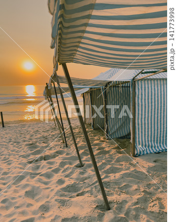 Sunset view over beach tents at Furadouro Ovar Sunset view over beach tents at Furadouro Ovar 141773998