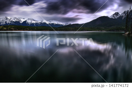 Snowy Mountain Lake Panorama with Dramatic Storm Clouds Snowy Mountain Lake Panorama with Dramatic Storm Clouds 141774172