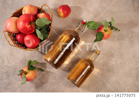 Apple cider with fruit in baskets, Thanksgiving decorations and country harvest, healthy natural food and home canning concept, long-term storage at home, banner for a screen, business card for cafe Apple cider with fruit in baskets, Thanksgiving decorations and country harvest, healthy natural food and home canning concept, long-term storage at home, banner for a screen, business card for cafe 141775075
