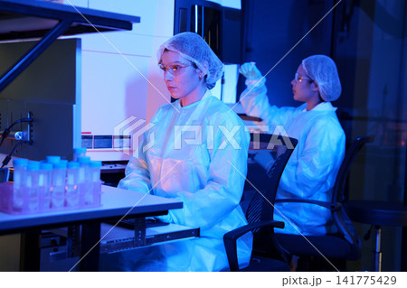 Laboratory Technicians Conducting Experiments in a Chemistry Lab Laboratory Technicians Conducting Experiments in a Chemistry Lab 141775429